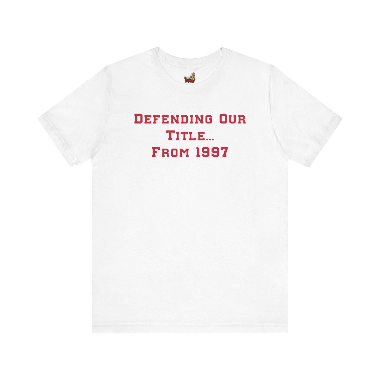 White t-shirt with red text 'DEFENDING OUR TITLE... FROM 1997' on a white background